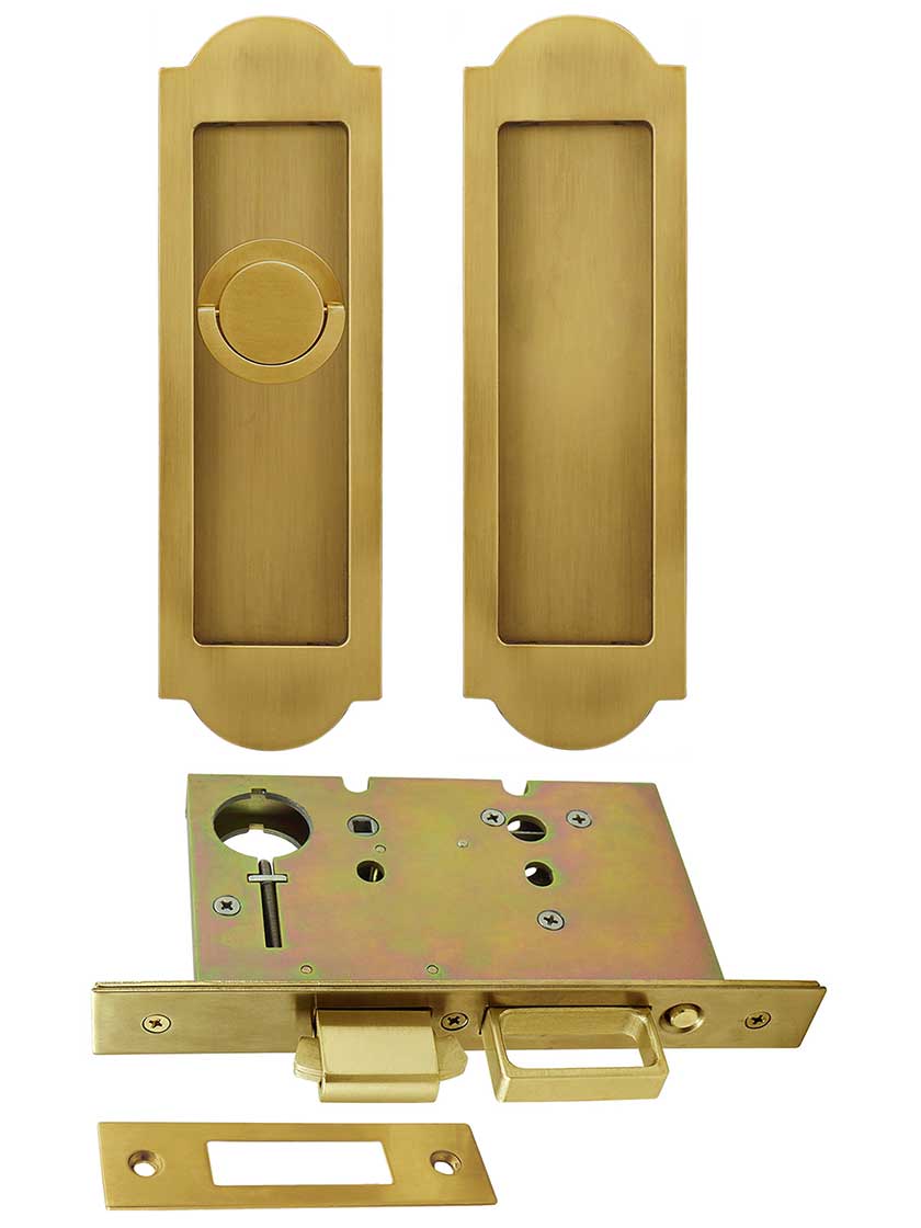 Premium Patio Pocket-door Mortise Lock set with Arched Pulls in Aged Brass.